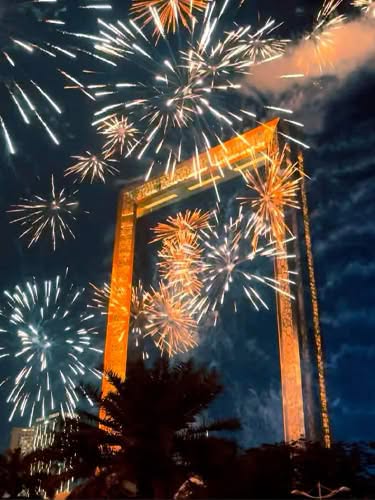Dubai Frame New Year fireworks viewed from a luxury yacht and dinner cruise