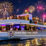 Crowds gathering to watch New Year celebrations with fireworks over Dubai and festive cruises along the waterfront.