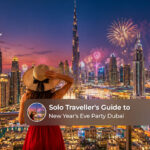 Solo traveller enjoying Dubai New Year's Eve celebrations with spectacular city lights.